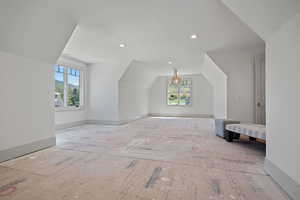 Bonus room featuring vaulted ceiling and recessed lighting