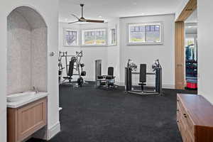 Exercise room with recessed lighting and ceiling fan