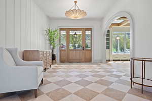 Foyer entrance featuring arched walkways