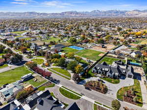Aerial view of home including acreage featuring a mountainous background
