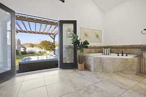 Primary en suite bath featuring private walk-out to hot tub