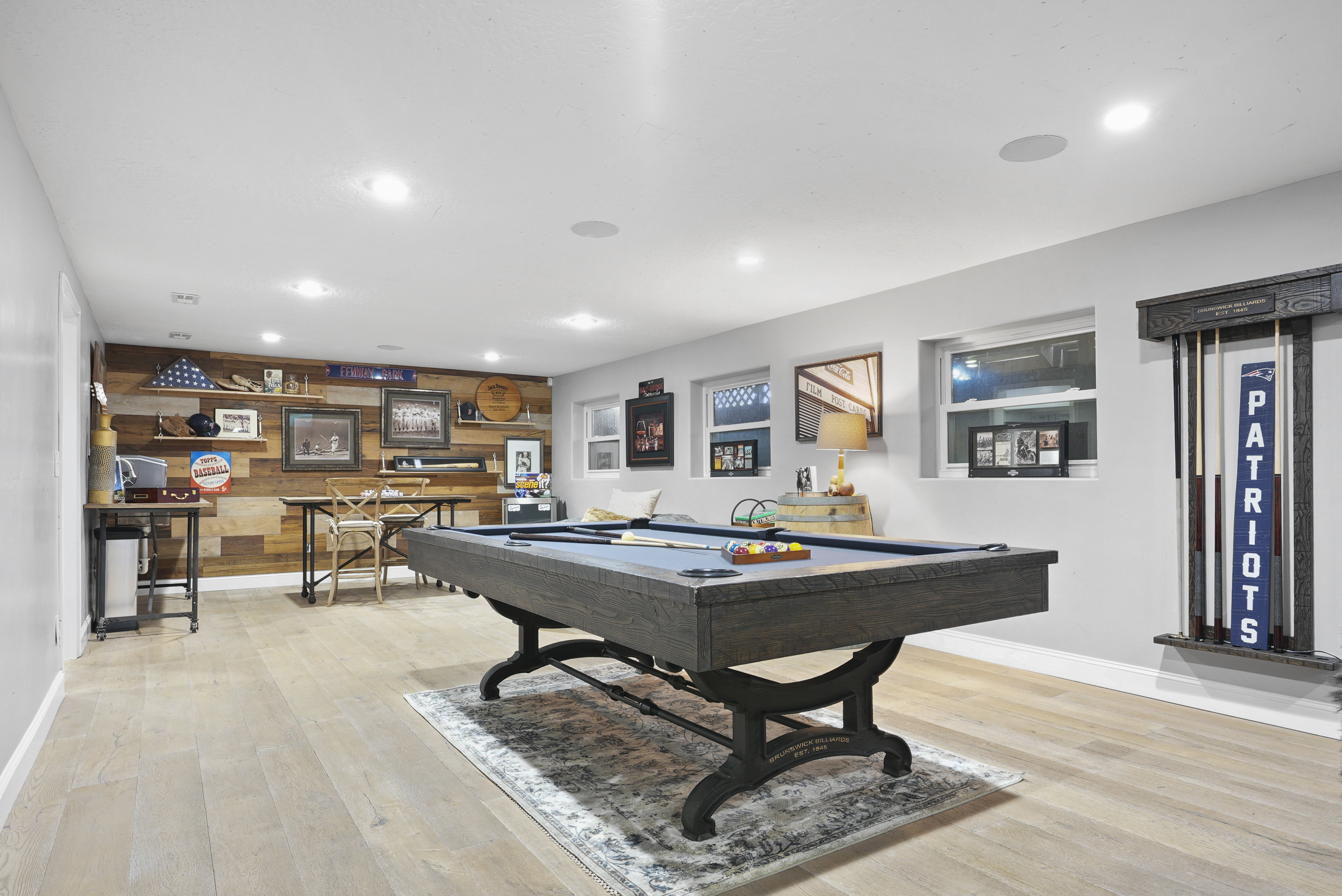 Game room pool table, recessed lighting, wet bar and wooden accent wall