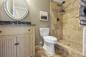 Full bathroom with vanity and a shower