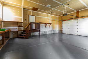 Garage featuring a garage door opener