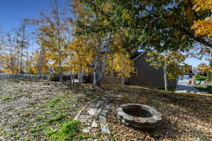 View of yard with a fire pit