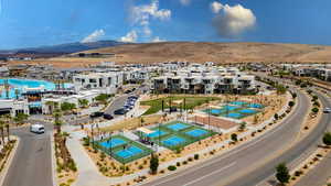 Aerial perspective of suburban area with a mountainous background