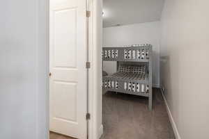 Bedroom with carpet flooring and baseboards