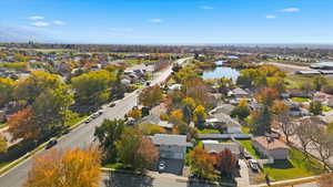 Aerial view of residential area featuring a nearby body of water