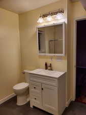 Bathroom with baseboards and vanity