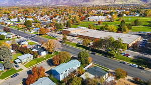 Aerial perspective of suburban area with a mountainous background