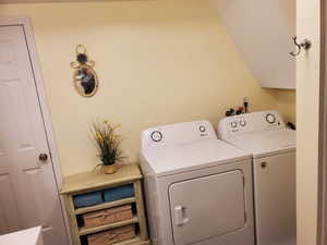Laundry area featuring washing machine and clothes dryer