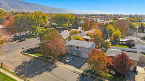 Aerial view of residential area featuring a mountainous background