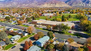 Aerial perspective of suburban area featuring a mountain backdrop