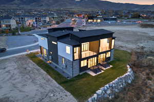 Aerial view at dusk of a mountain view and a residential view