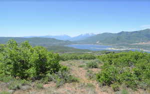 View of mountain background featuring a nearby body of water