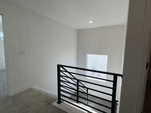 Stairway featuring carpet flooring and recessed lighting