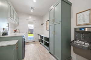 Washroom with recessed lighting and wooden walls