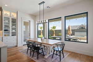 Dining area featuring light wood-style floors and recessed lighting