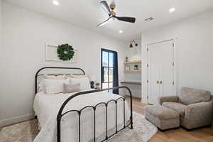Bedroom featuring light wood finished floors, recessed lighting, a ceiling fan, and a closet