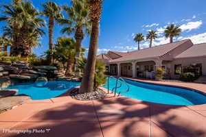 Swimming pool with a patio area
