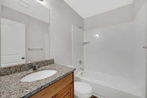 Full bathroom with shower / bath combination and vanity