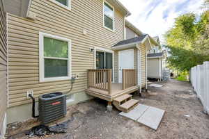 Rear view of property with a deck