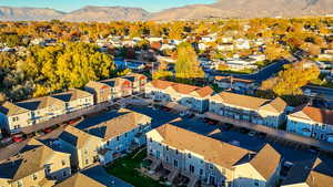 Aerial perspective of suburban area featuring a mountain backdrop