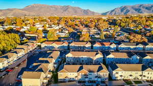 Aerial view of residential area featuring a mountainous background