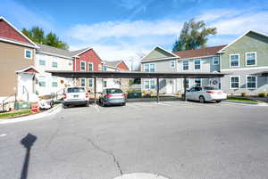 Covered parking lot featuring a residential view