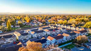 Aerial perspective of suburban area featuring a mountainous background