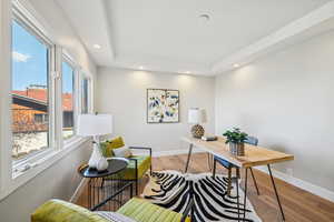 Office space featuring wood finished floors and recessed lighting