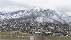 View of mountain background featuring nearby suburban area