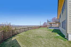Fenced backyard featuring a patio area