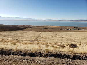 Water view with a mountainous background and rural landscape