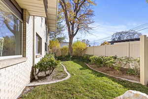 View of fenced backyard