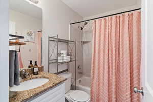 Full bathroom with vanity and shower / bath combo