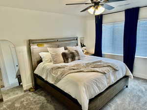 Bedroom with carpet floors and a ceiling fan