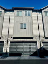 View of side of property with an attached garage