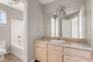 Bathroom with washtub / shower combination and vanity