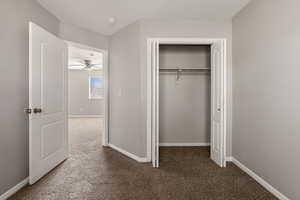 Unfurnished bedroom with carpet and a closet