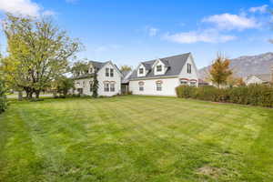 View of front facade with stucco siding and a mountain view