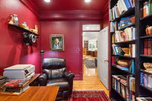 Sitting room featuring crown molding, light wood finished floors, and recessed lighting