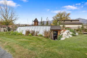View of grassy yard featuring a mountain view