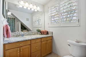 Full bath featuring a shower with shower curtain and vanity