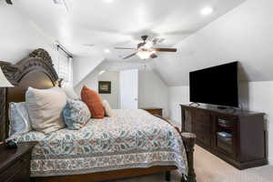 Bedroom featuring lofted ceiling, light carpet, a ceiling fan, a textured ceiling, and recessed lighting