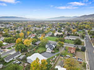 Aerial view of residential area featuring a mountainous background