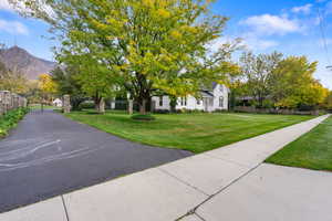 View of front facade featuring a gate and a mountain view