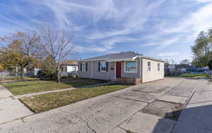 View of front of house featuring concrete driveway