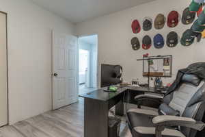 Home office featuring light wood-style flooring