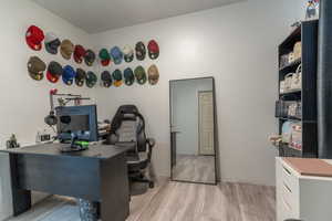 Home office featuring light wood-style flooring